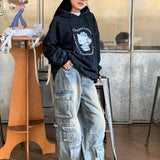 Pantaloni cargo con tasche patchwork in denim da strada