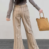 Jeans a zampa slim a vita bassa color cachi a righe