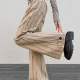 Jeans a zampa slim a vita bassa color cachi a righe