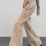 Jeans a zampa slim a vita bassa color cachi a righe