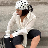 Camicetta asimmetrica a maniche lunghe in Tencel trasparente