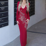 Abito lungo aderente con scollo a V e strass