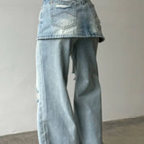 Jeans larghi irregolari a vita alta in denim lavato