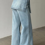 Jeans larghi irregolari a vita alta in denim lavato