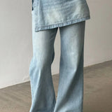 Jeans larghi irregolari a vita alta in denim lavato
