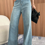 Jeans larghi svasati a vita alta e snellenti