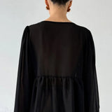 Camicetta in chiffon bianco con scollo a V e volant