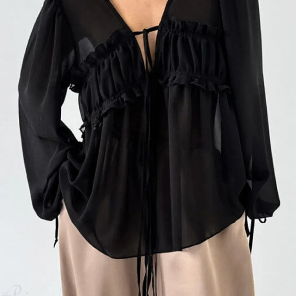 Camicetta in chiffon bianco con scollo a V e volant