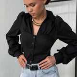 Camicetta bianca in cotone con colletto e maniche a sbuffo