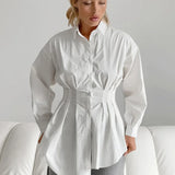 Camicetta bianca aderente con vita plissettata