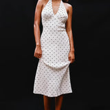 Abito lungo con scollo a V e scollo all'americana a pois bianchi