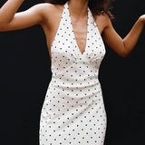 Abito lungo con scollo a V e scollo all'americana a pois bianchi