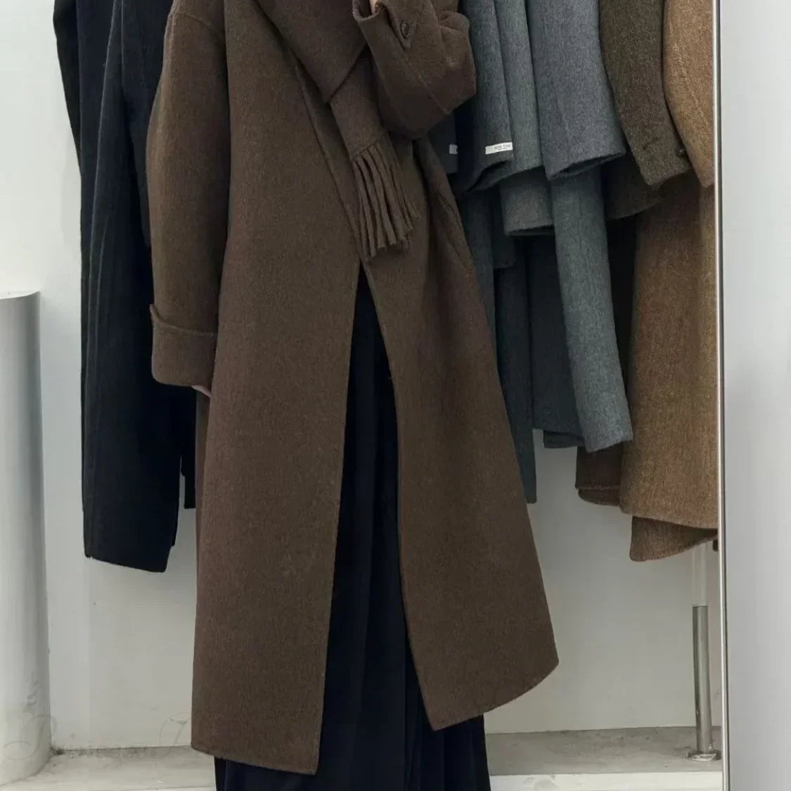 Soprabito di lana con un bottone e maniche lunghe