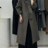 Soprabito di lana con un bottone e maniche lunghe