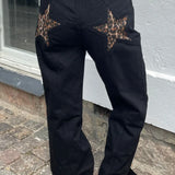 Jeans patchwork color-block con stelle Y2K