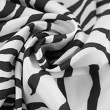 Gonna lunga drappeggiata a vita alta con stampa zebrata